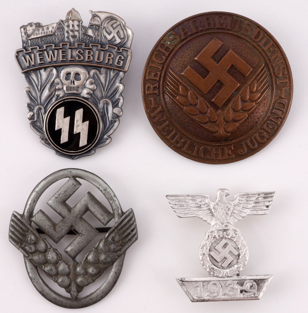 LOT OF 4 WWII GERMAN BADGES WEWELSBURG: Lot features a Wewelsburg pin, and 2 RAD pins. One in brass. Also included is an Iron Cross spange. Unauthenticated, sold as is.