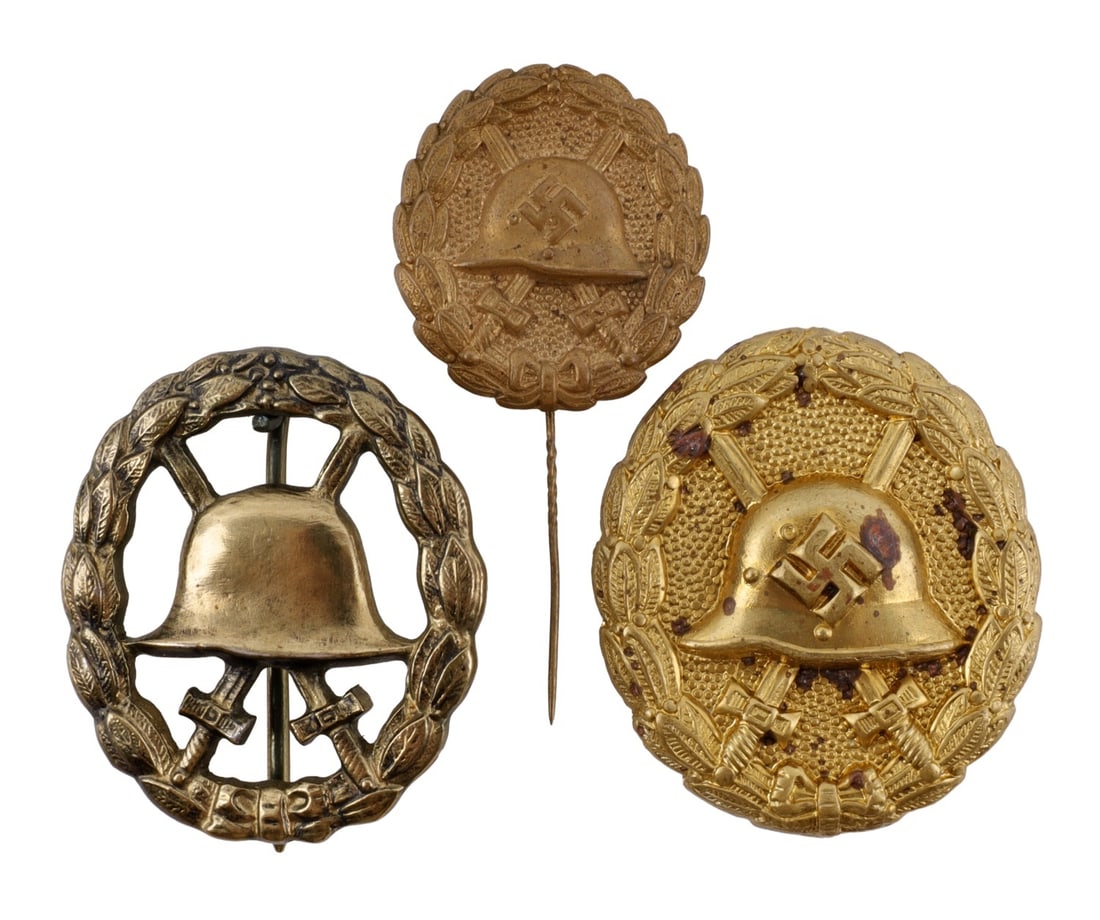 WWII GERMAN THIRD REICH WOUND BADGE IN GOLD LOT 3: Three wound badges in gold. 1) WWI-era, with solid back and no maker's mark. 2) WWII-era, with a hollow back and no maker's mark. 3) WWII-era wound badge pin.