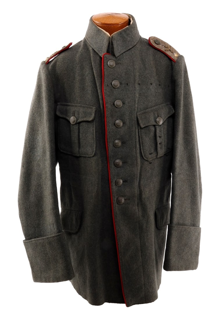 WWI IMPERIAL GERMAN PILOT TUNIC FOR LIEUTENANT: WWI Imperial German Pilot Tunic for Lieutenant. Wool tunic with shoulder boards featuring pip and aviation wings, buttons are scooped back type with make difficult to read. Tunic is for a large man. S
