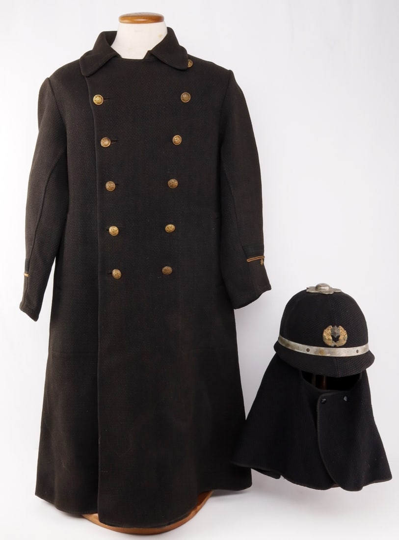 WWII JAPANESE HIKESHI FIRE BRIGADE COAT & HELMET: Imperial Japanese hikashi banten, or fire brigade woven coat with helmet. Helmet of rattan with woven cloth exterior and twill liner, stamped twice in orange ink. Fine condition. Oxidation of helmet n