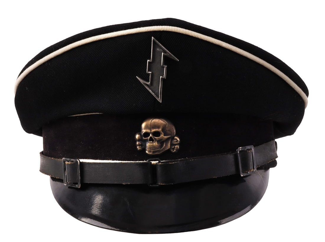 WWII GERMAN ALLGEMEINE SS OFFICER VISOR: Black gabardine construction with black velvet band. Wolfsangel pin and Totenkopf pin featured. White piping at the top. Hard leather visor. Leather chin strap. Reverse seam centered. Visor features S