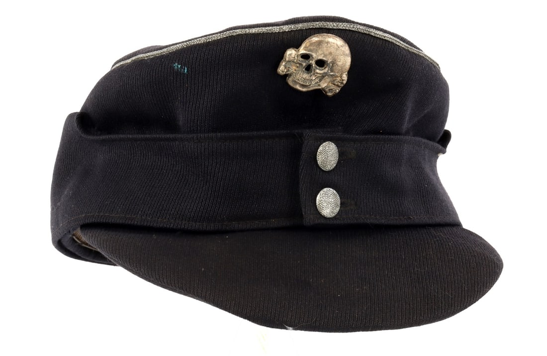 WWII GERMAN THIRD REICH ALLGEMEINE M43 VISOR: M-43 visor with Totenkopf pin. Piping is in bullion thread. Gabardine construction. Interior features silk lining. Under the lining is cheese cloth style fabric.