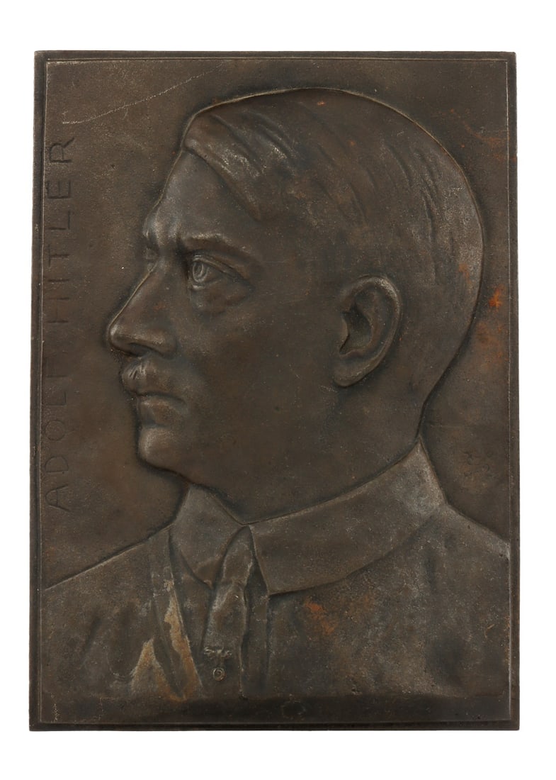 WWII GERMAN ADOLF HITLER BRONZE PLAQUE: Bronze plaque with Hitler's head. Adolf Hitler in vertical writing. No marks on reverse. It measures 7 7/8 X 5 5/8 inches. Signed near his neck.