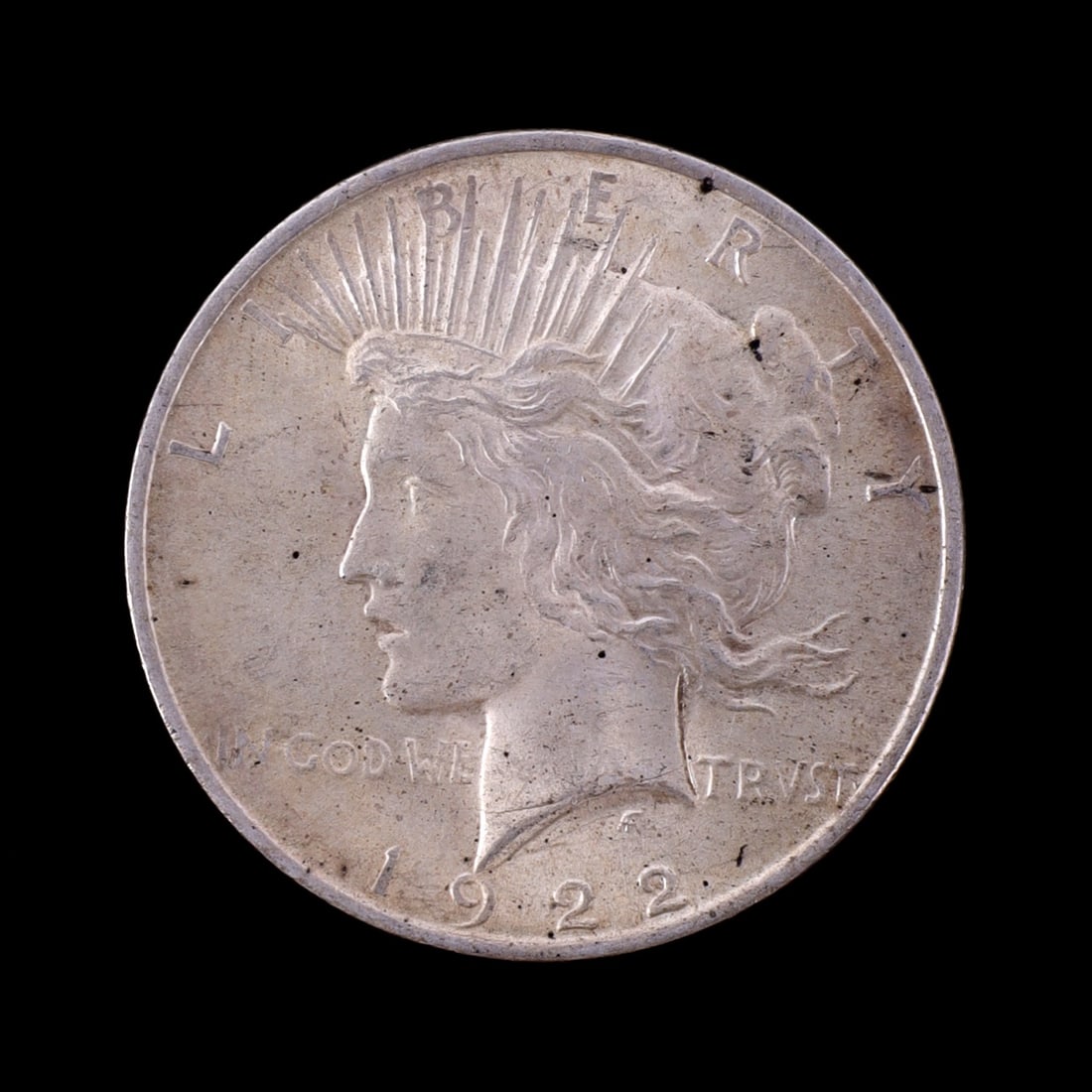 ONE US SILVER PEACE DOLLAR 1922: Two US 90% silver peace dollars. 1923. This lot reserved at melt.