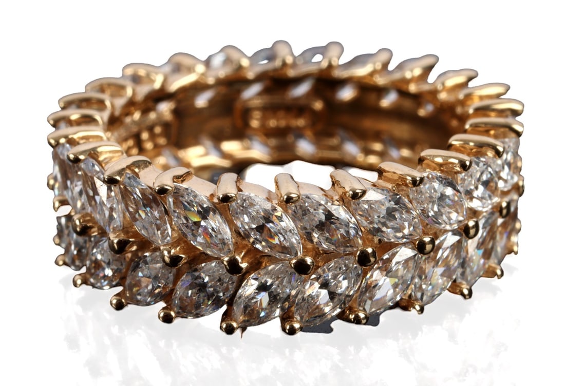 14KT YELLOW GOLD INFINITY RING MARQUIS CZ SZ 5.25: Stamped 14K CZ inside shank. Total weight 4.609 grams. In very good condition without stones or settings. Perfect for travel or everyday wear. | | This lot has a reserve.