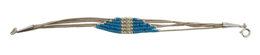 SOUTHWEST NATIVE LIQUID SILVER BRACELET: A Southwest bracelet with liquid silver strands and blue beadwork. Approximately 7 inches. Very good, original condition. This lot has a reserve.