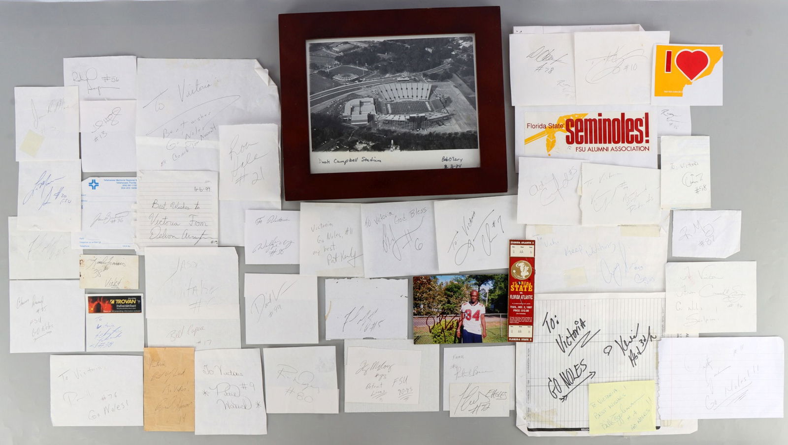 ASSORTED FSU FOOTBALL MEMORABILIA BOBBY BOWDEN: A large, varied selection of various FSU memorabilia items. Includes numerous autographs on various pieces of paper, Bobby Bowden's autographed book, posters autographed by various players and Bobby