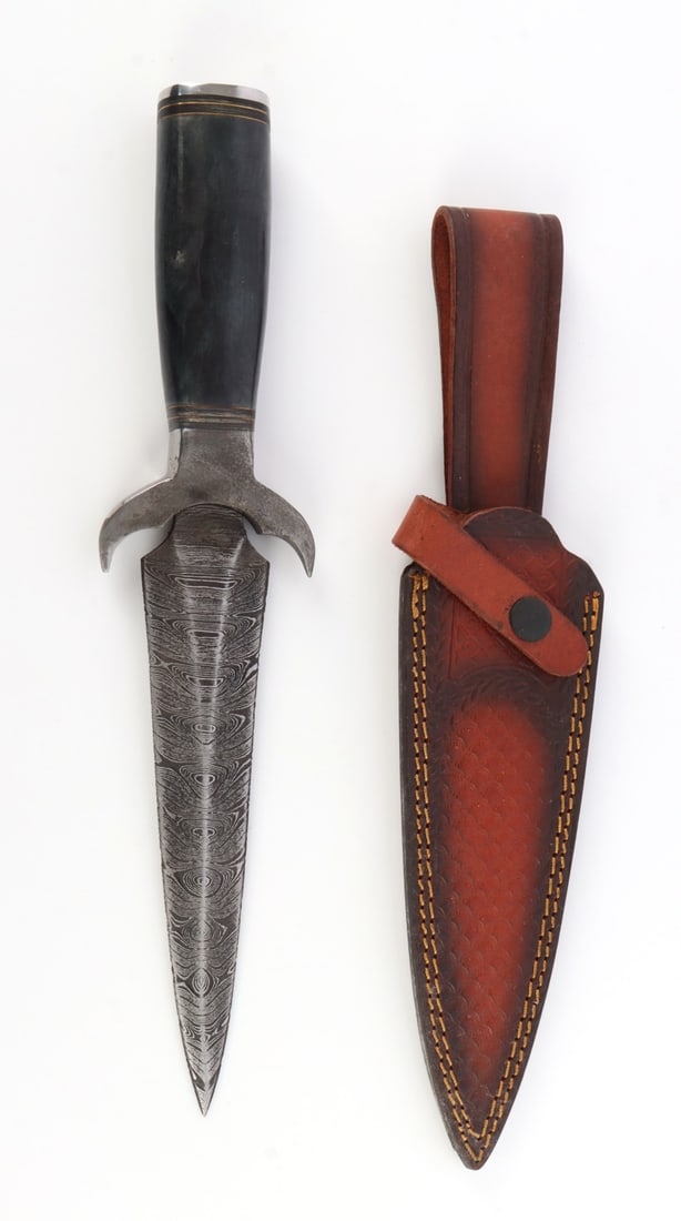 DAMASCUS PATTERN FIGHTING DAGGER: A fighting dagger with a Damascus forge pattern. 8 inch blade. 13.5 inch total length.