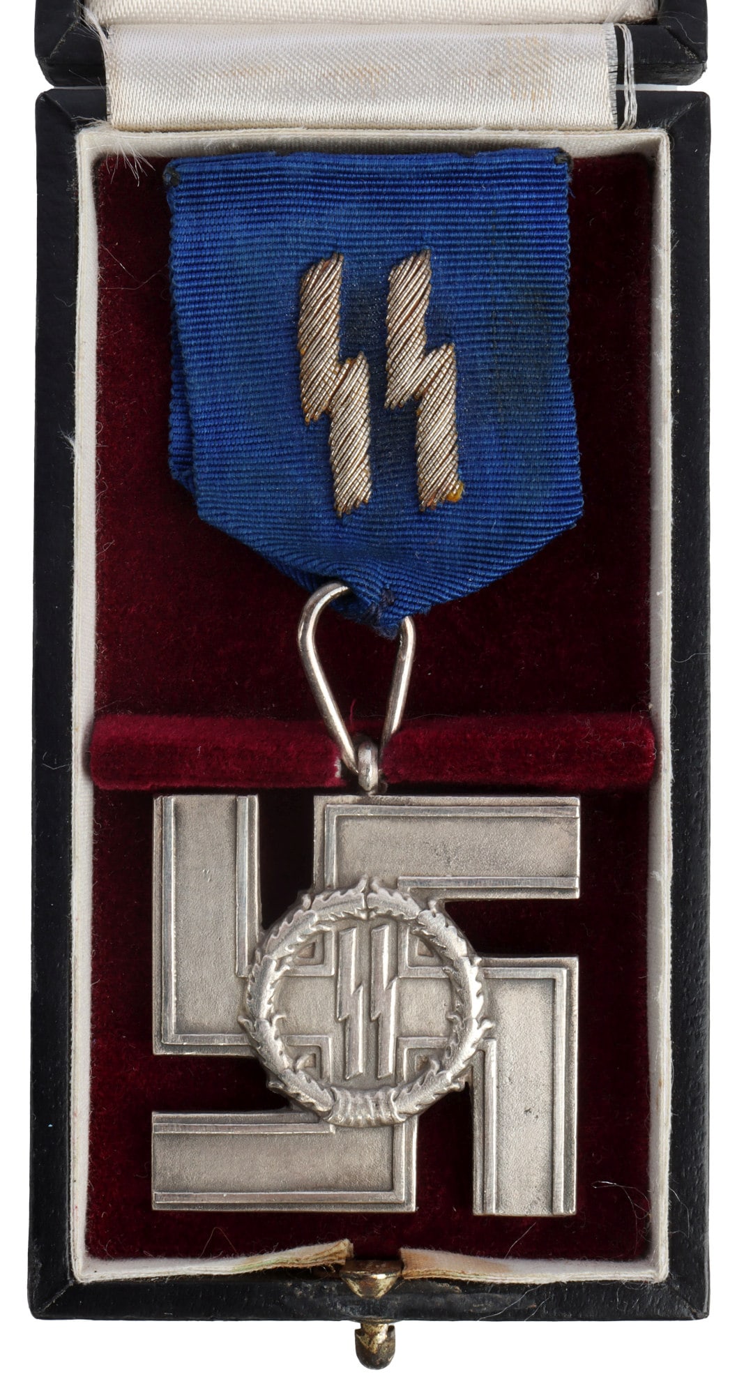 WWII GERMAN SS 15 YEAR SERVICE CROSS WITH CASE: Non-magnetic silvered cross with blue ribbon and silver bullion SS runes. Motto on reverse. It measures 1 3/8 inches. This lot has a reserve.