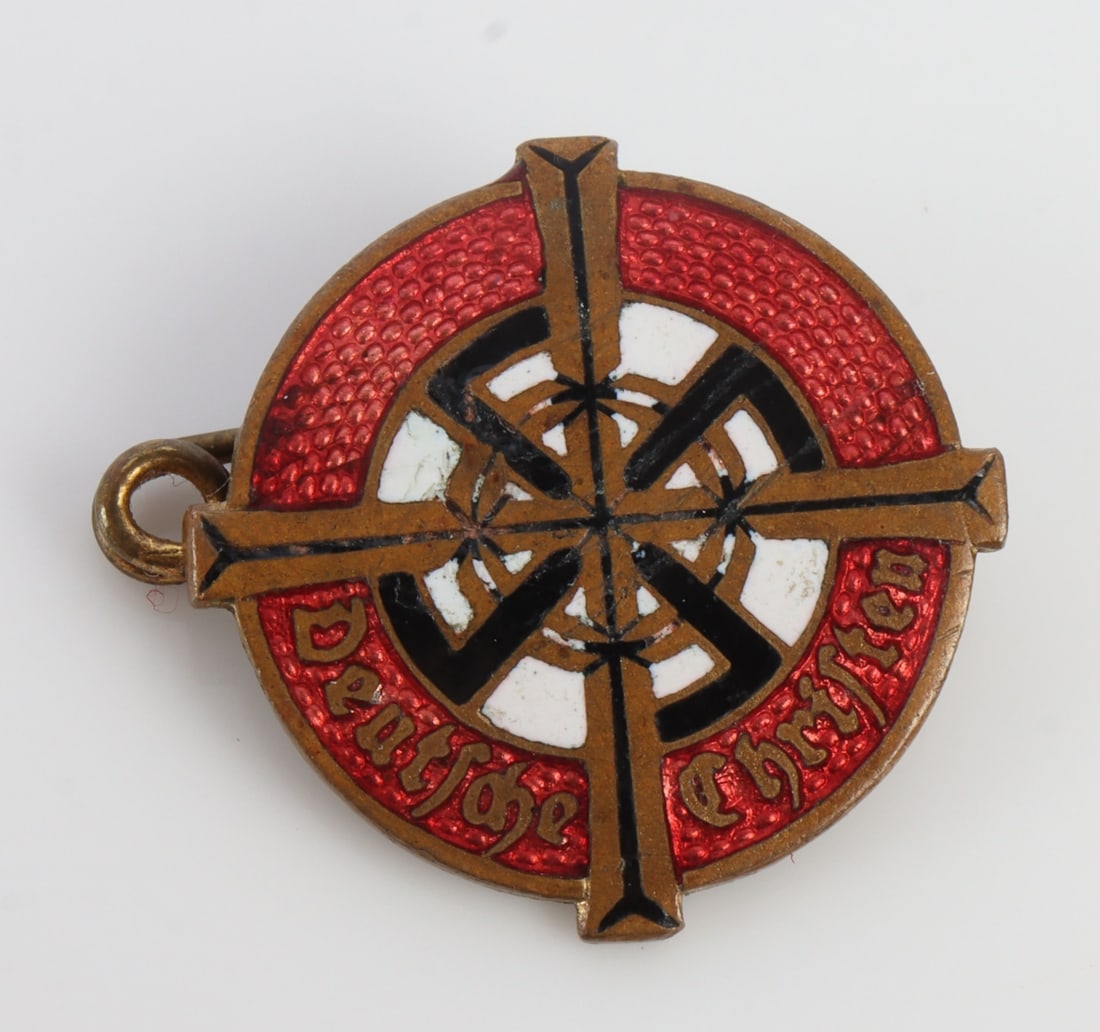 WWII THIRD REICH GERMAN CHRISTIAN MEMBERSHIP BADGE: German Christians membership pin. Red, white, and black enamel with brass cross. Willi Merten maker on reverse. Measures 3/4 inches.