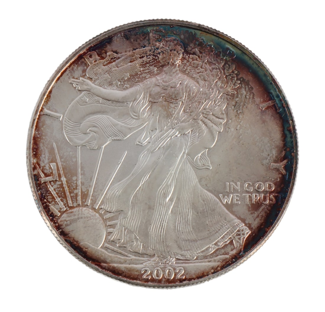 ONE US SILVER EAGLE 1 OZT .999 FINE SILVER COIN: One .999 fine silver eagle. 1 ozt. 2002. This lot reserved at melt. || Payment & Shipping: Accounts without purchase history must pay via Zelle, money order, cashier's check or wire transfer. Items wi