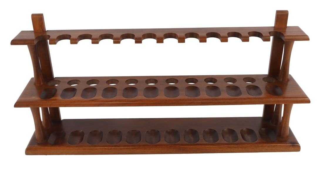 DECATUR INDUSTRIES 24 PLACE WALNUT PIPE RACK STAND: Decatur Industries solid walnut pipe stand, 24 places. Width 21 inches. Depth 4 inches. Height 10 inches.