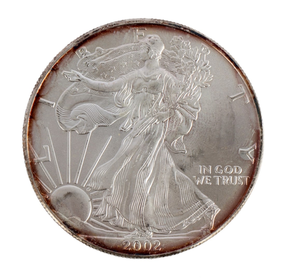 ONE US SILVER EAGLE 1 OZT .999 FINE SILVER COIN: One .999 fine silver eagle. 1 ozt. 2002. This lot reserved at melt. || Payment & Shipping: Accounts without purchase history must pay via Zelle, money order, cashier's check or wire transfer. Items wi