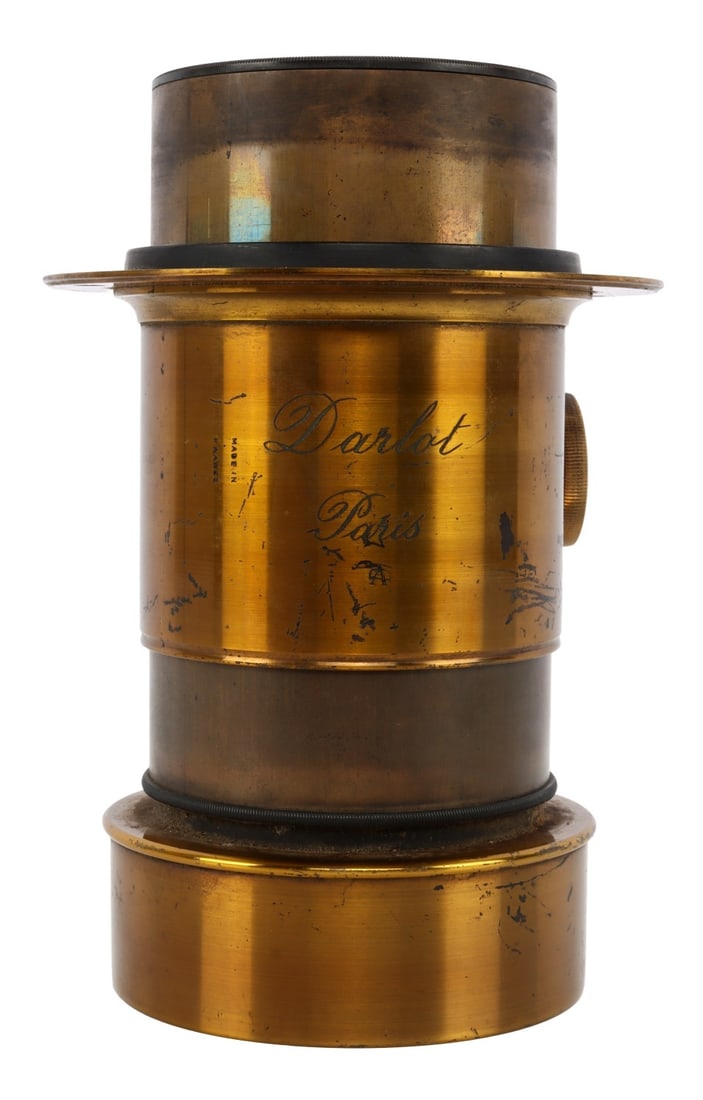 DARLOT PARIS 5-INCH ANTIQUE BRASS CAMERA LENS: Lens length 5 inches, exclusive of hood. Lens diameter 42mm. Mounting flange has 4 holes spaced approx. 2.75 inches.
