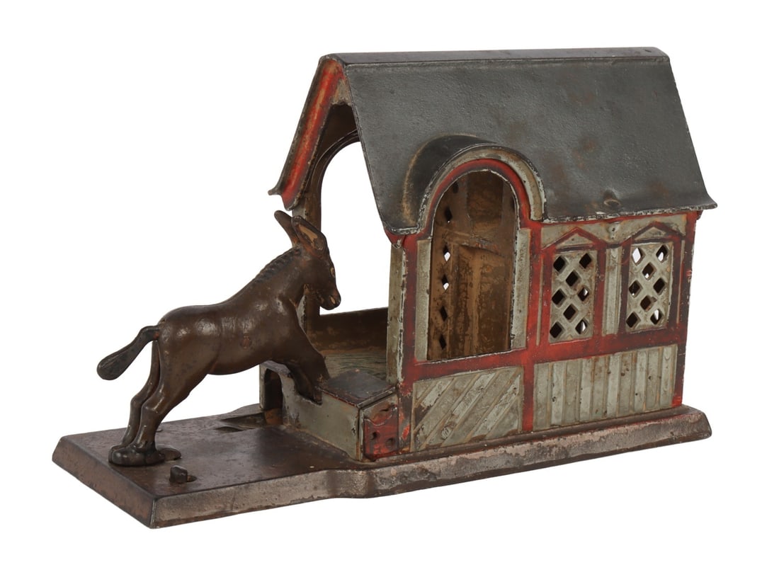 J&E STEVENS KICKING MULE CAST IRON BANK: A kicking mule cast iron bank from J&E Stevens. 8.6 X 6 3.5 inches.