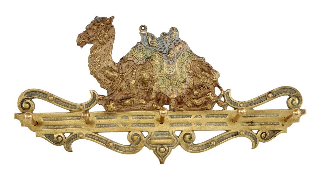 JUDD COMPANY BRASS CAMEL RACK: A brass camel rack from the Judd Company, nineteenth century. 11.5 X 6 inches.