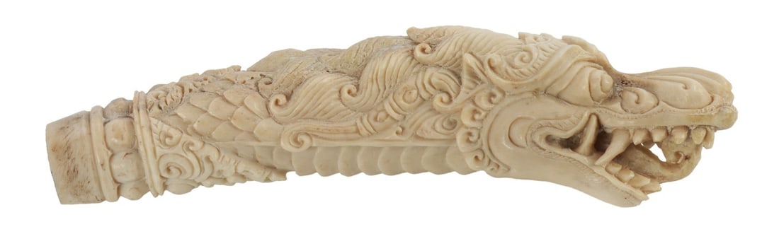 EAST ASIAN DRAGON HEAD KNIFE GRIP: Hand carved dragon head design. Appears to be crafted from stag horn or similar.
