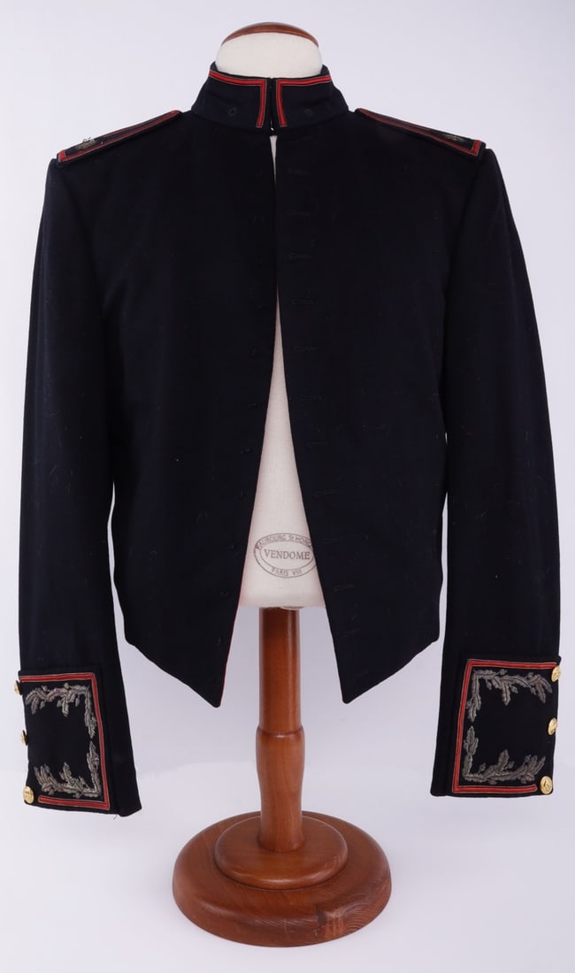KOREAN WAR USMC OFFICER'S MESS DRESS JACKET: US Marine Corps major's mess dress jacket of black wool. Red piping and silver bullion wire embroidering. Red faux silk liner. Buttons marked "Waterbury Button Co."