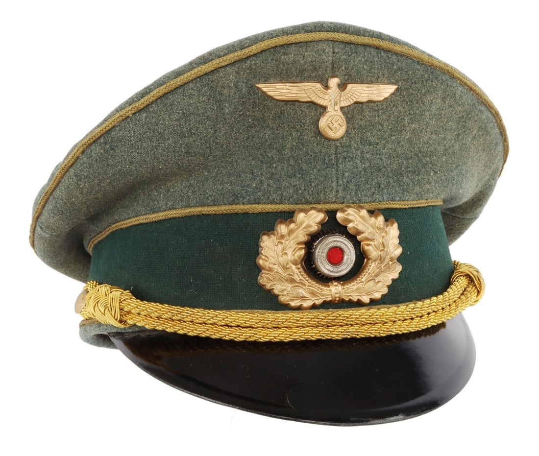 WWII GERMAN THIRD REICH GENERALS VISOR DECKER: A visor for a general of the Wehrmacht of the German Third Reich. Field gray cloth with black velvet band. Reichsadler and cockade badges on front. Gold bullion strap. Tight and aligned back seam. Har
