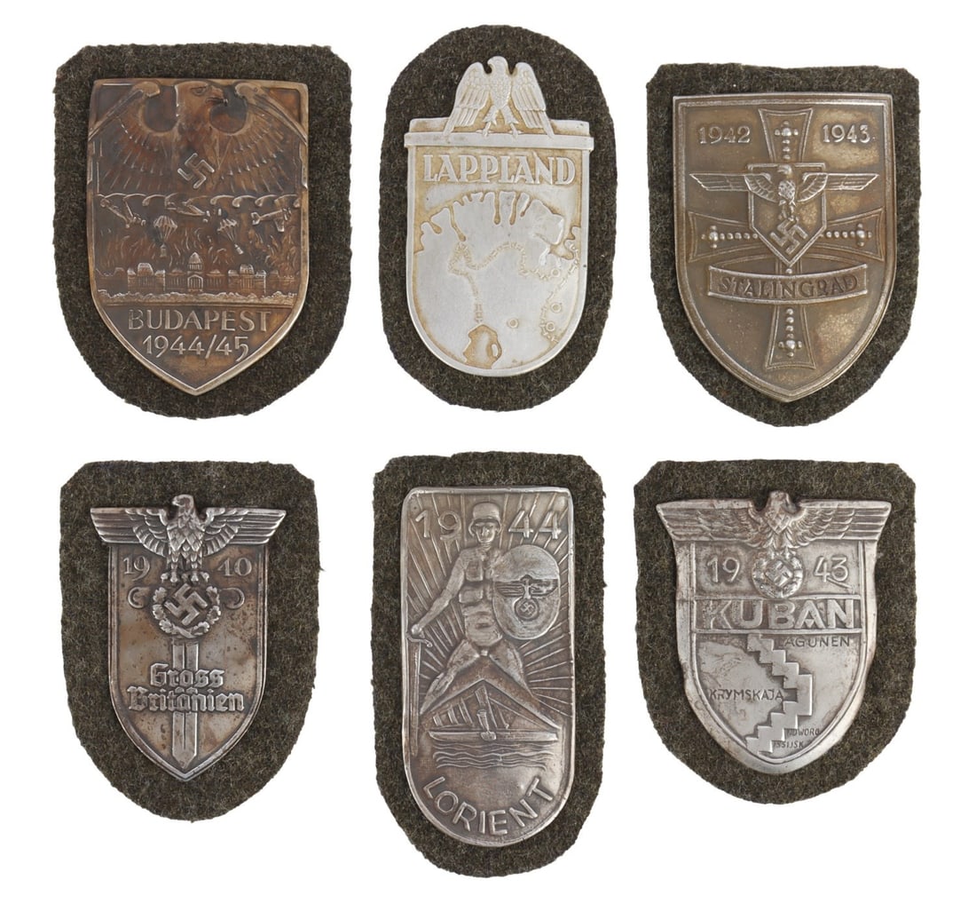 WWII GERMAN THIRD REICH CAMPAIGN PLAQUES LOT OF 6: Six plaques representing the campaigns of the German Third Reich. 1) Stalingrad. 2) Gross Britanien. 3) Lorient. 4) Lappland. 5) Budapest. 6) Kuban.