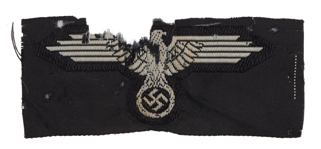 WWII GERMAN THIRD REICH SS CAP EAGLE: An eagle for an SS cap. Non-fluorescing. Purported veteran bring back. This lot has a reserve.