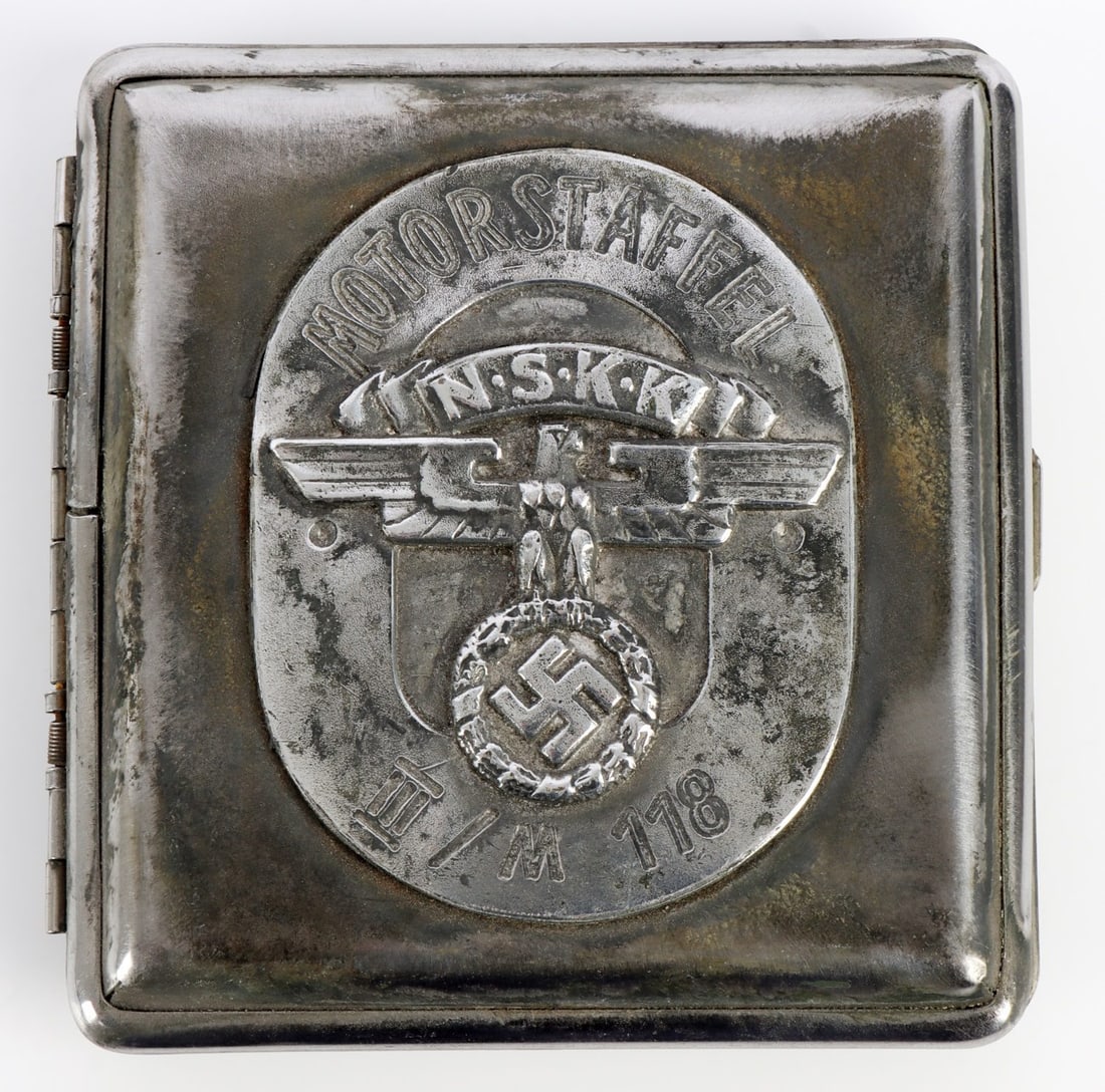 WWII GERMAN THIRD REICH CIGARETTE CASE HUNTING: A cigarette case bearing the symbols of the German Third Reich and the symbols of the Iron Cross and a hunting society. with swastika symbol.