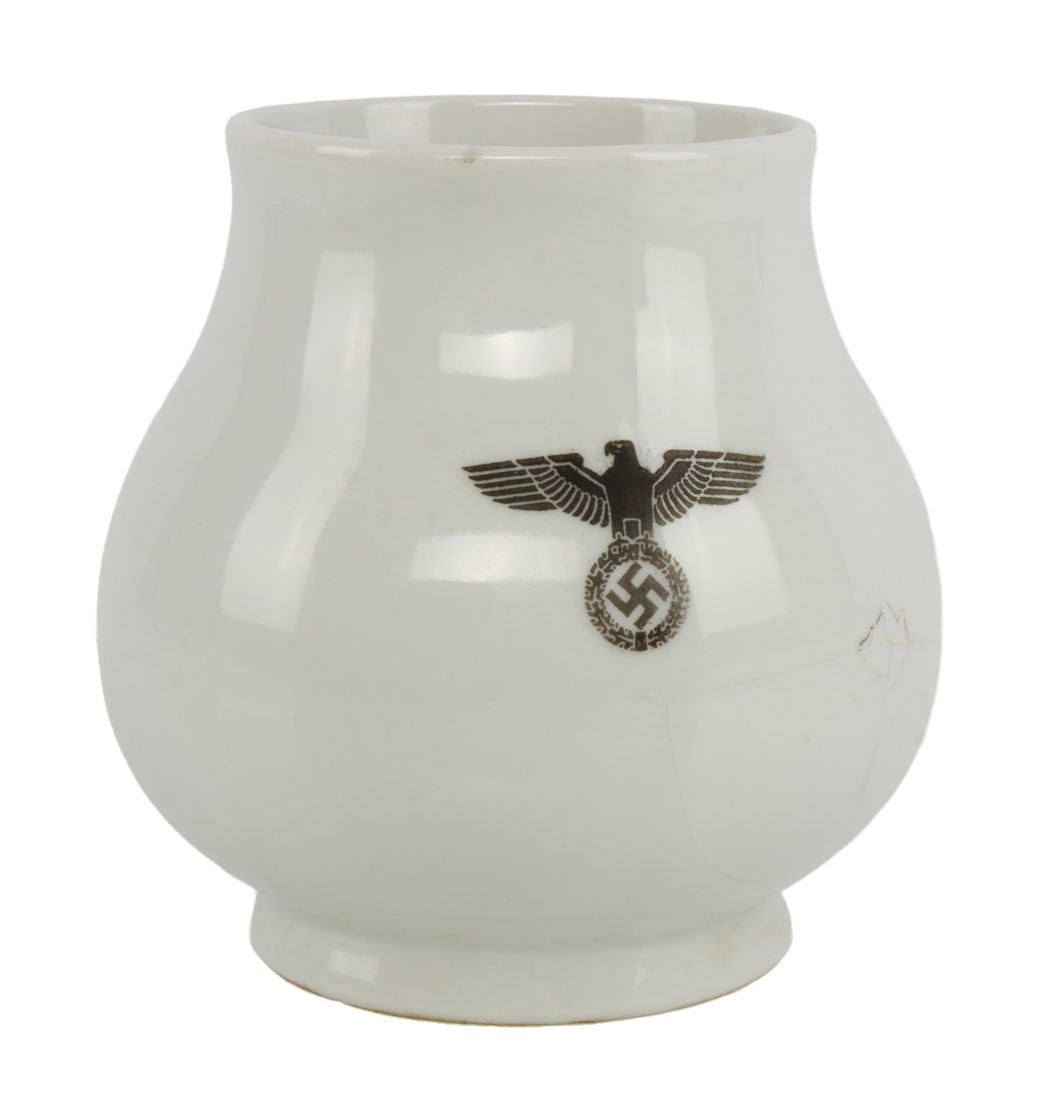 WWII GERMAN THIRD REICH WATER JUG: Water jug with a Reichsadler and swastika. "Jager Berlin 1938" and smaller Reichsadler on bottom. 4.5 inches tall.