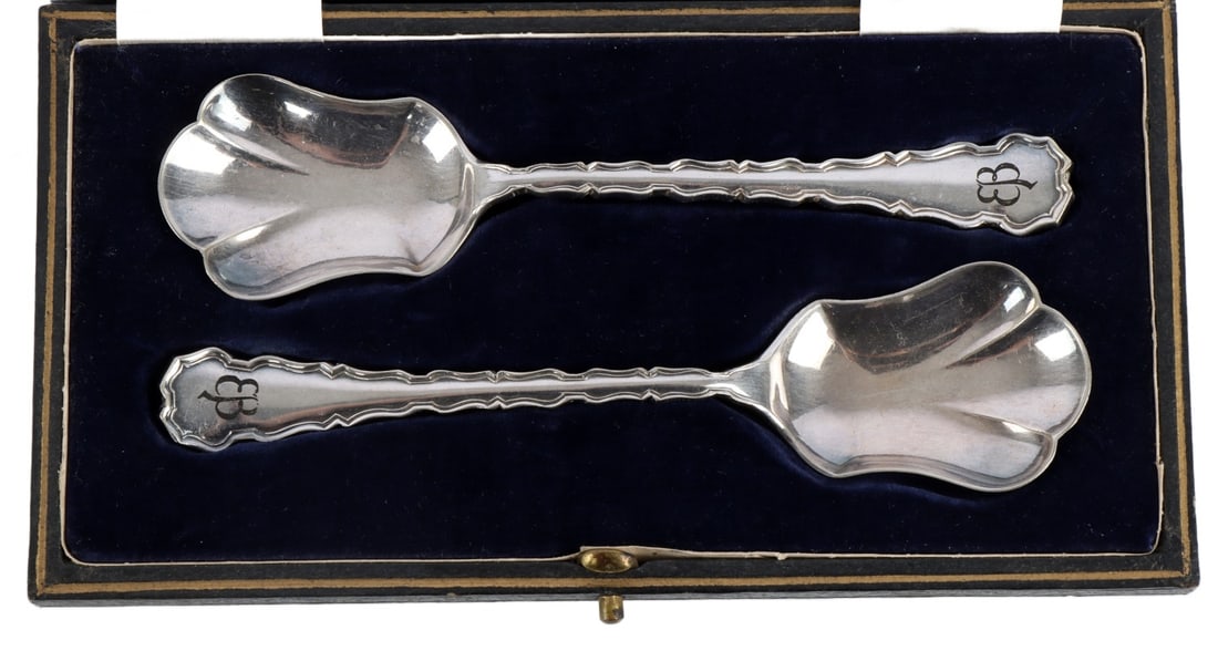 WWII GERMAN THIRD REICH EVA BRAUN SUGAR SPOONS: A set of two sugar spoons, in case, bearing the 'butterfly; monogram of Eva Braun.