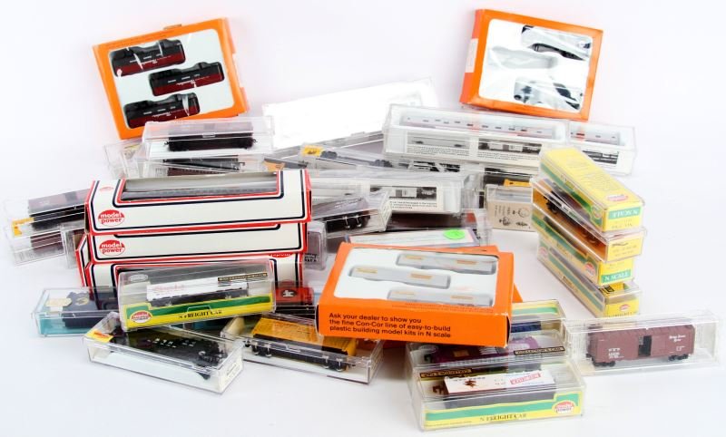 N GAUGE TRAIN FREIGHT CAR LOT ATLAS CON COR HERPA: Virtually all of the cars are mint in box, approximately 45 boxes with Freight cars and some freight truck trailers, variety of makers but most are Atlas.