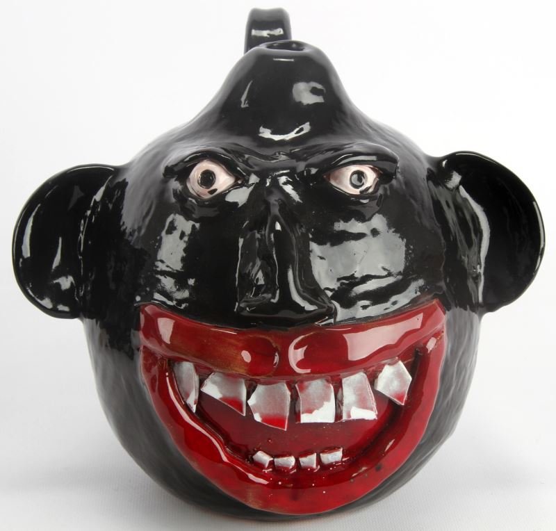 CLAUDE MILLER SIGNED HAND FORMED BARACK OBAMA JUG: Signed and dedicated on bottom with "To Joel Carpenter / Claude Miller / Our Leader / #8 09" and on back with " 44th Pres / 1st Black Pres ? To Joel Carpenter". Nine inches tall, ten inches across ear