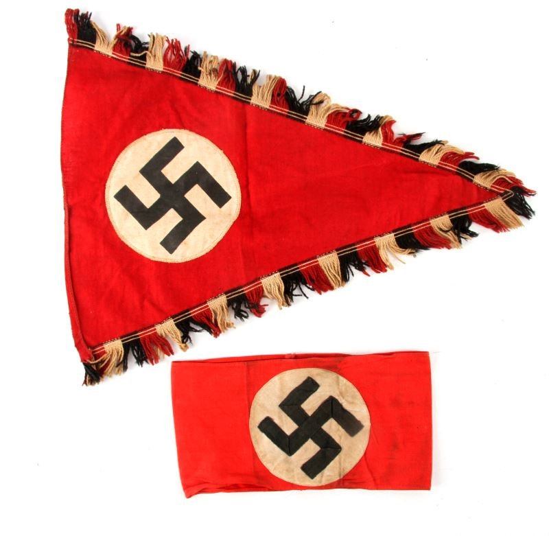 WWII GERMAN ARMBAND AND AUTOMOTIVE PENNANT: WWII German NSDAP party armband, and small pennant measuring about 13 inches, likely an automotive pennant. Both in good condition. This lot has a reserve.