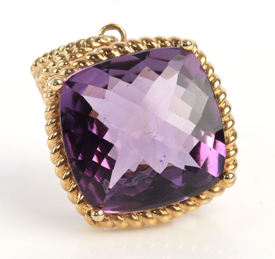 14KT GOLD CUSHION CUT AMETHYST PENDANT 9 CARATS: Large 9.44 carat cushion cut amethyst pendant set in 14kt yellow gold. Stone is 14.02 X 13.90 X 7.75 mm. Piece is unmarked acid test for 14kt. This lot has a reserve.