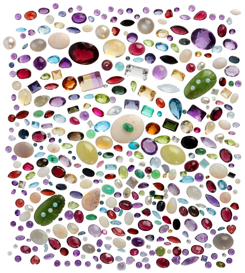 LARGE LOT OF LOOSE SEMI-PRECIOUS GEMS 290CT TW: Large lot of mixed gem stones. Size 10ct to melee. Gemstone highlights: Garnet, opal, Colombian emerald, and many more. Variety of cuts, colors and clarity. This lot has a reserve.