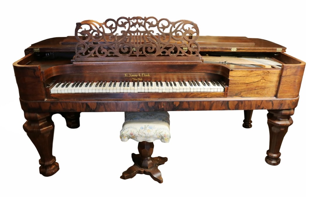 NUNNS & CLARK EMPIRE STYLE GRAND PIANO: A Nunns & Clark Grand Piano with Aeolian harp attachment. This particular model is rectangular, with slightly rounded edges and is a combination of Empire Revival and Rococo styles. This model