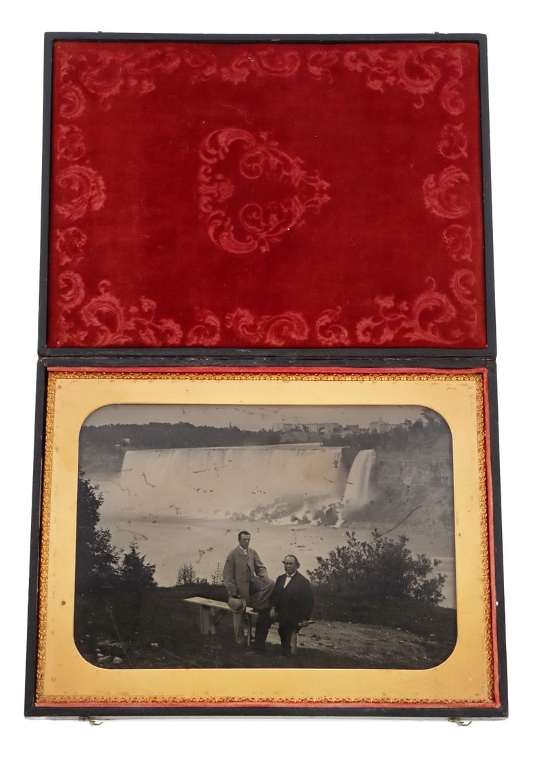 NIAGARA FALLS PORTRAIT CASED WHOLE PLATE AMBROTYPE: Ambrotype portrait of two gentleman at Niagara Falls. In embossed leather case with velvet liner. Image sight 7.25 x 5.25 inches. Case 9 x 7 inches.