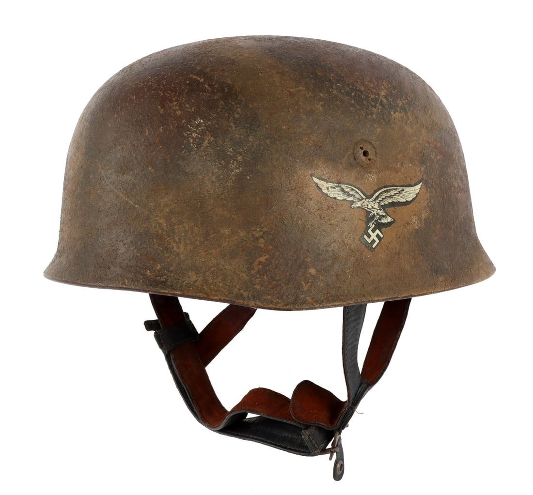WWII GERMAN REICH FALLSCHIRMJAEGAR M38 HELMET: An M38 fallschirmjaeger helmet from the Second World War. The shell and the liner appear to be original, decal likely added post-war. Karl Heisler marked as manufacturer of liner. Normandy paint. Appr