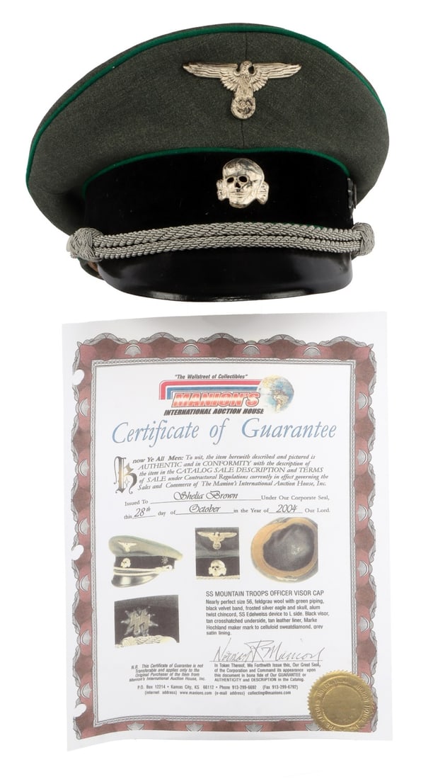 WWII GERMAN REICH WAFFEN-SS MOUNTAIN TROOP VISOR: A visor for a mountain troop of the Waffen-SS. Reichsadler and Totenkopf badges on front, field gray cloth with black velvet band and hard leather visor. Silver bullion strap for junior officer. Edelw