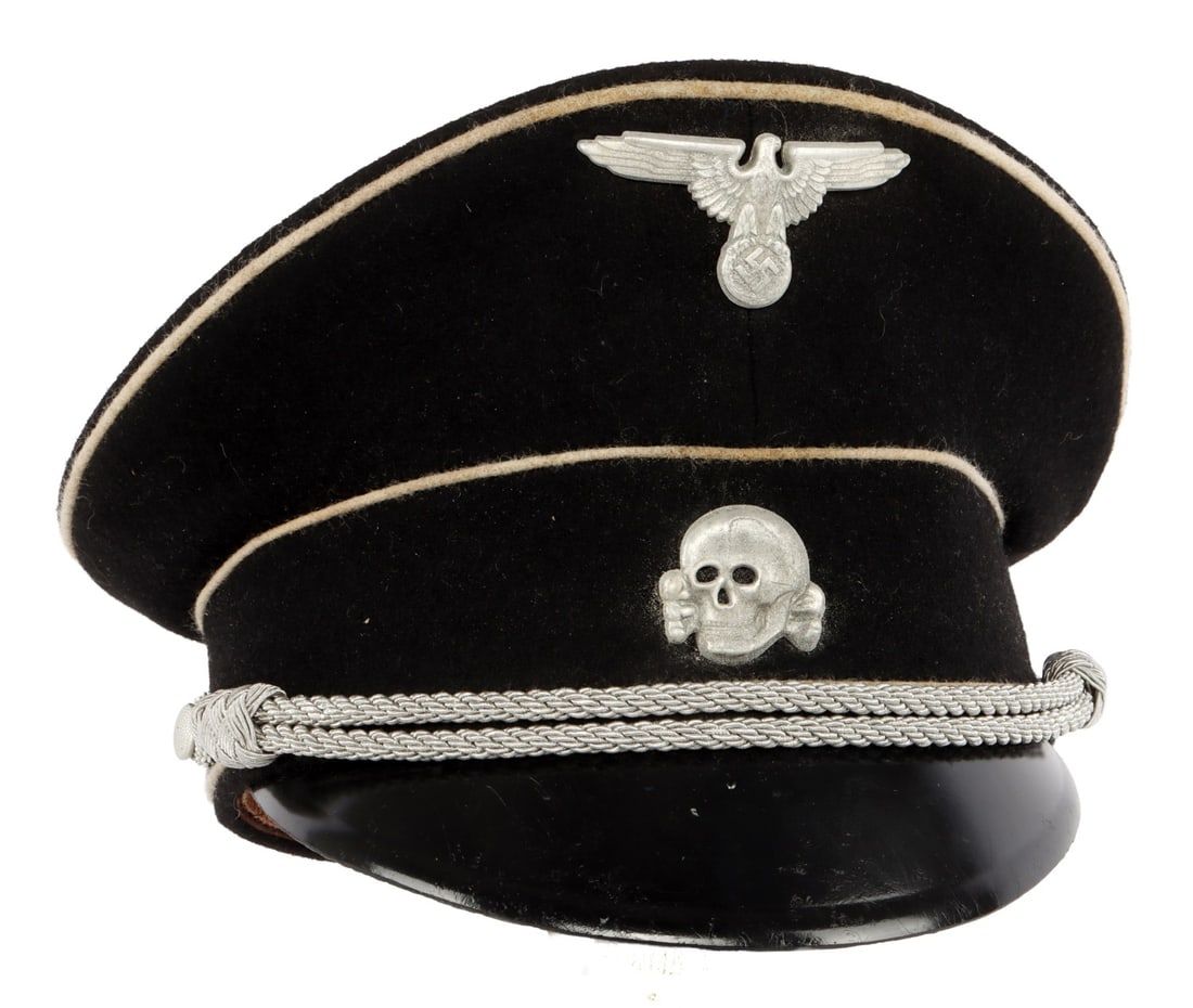 WWII GERMAN THIRD REICH ALLGEMEINE SS VISOR: A visor for the Allgemeine-SS of the German Third Reich. Reichsadler and Totenkopf badges on front. Silver bullion thread indicates junior officer. SS ink stamp and cloth stamp. Approximately size 7.