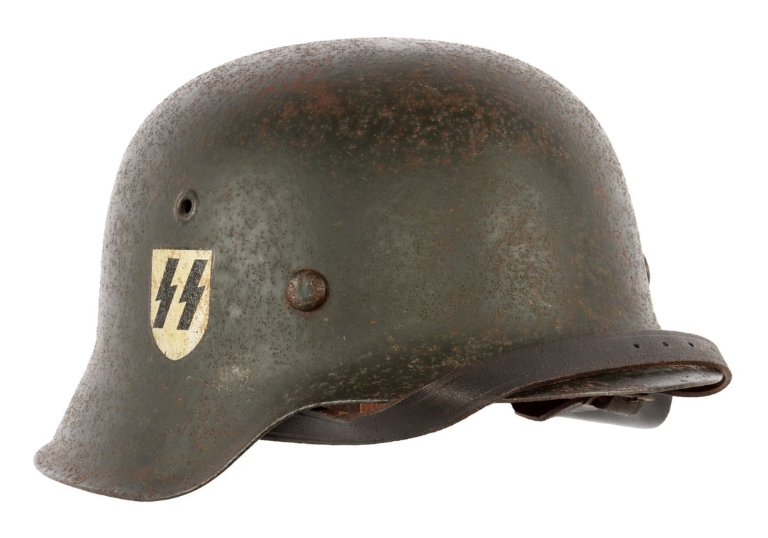 WWII GERMAN THIRD REICH M42 SS STAHLHELM: A Stahlhelm for the German Third Reich, bearing the decal of the Waffen-SS. 2520 nape stamp, ET66 ear stamp. NCO leather strap. Size 66.