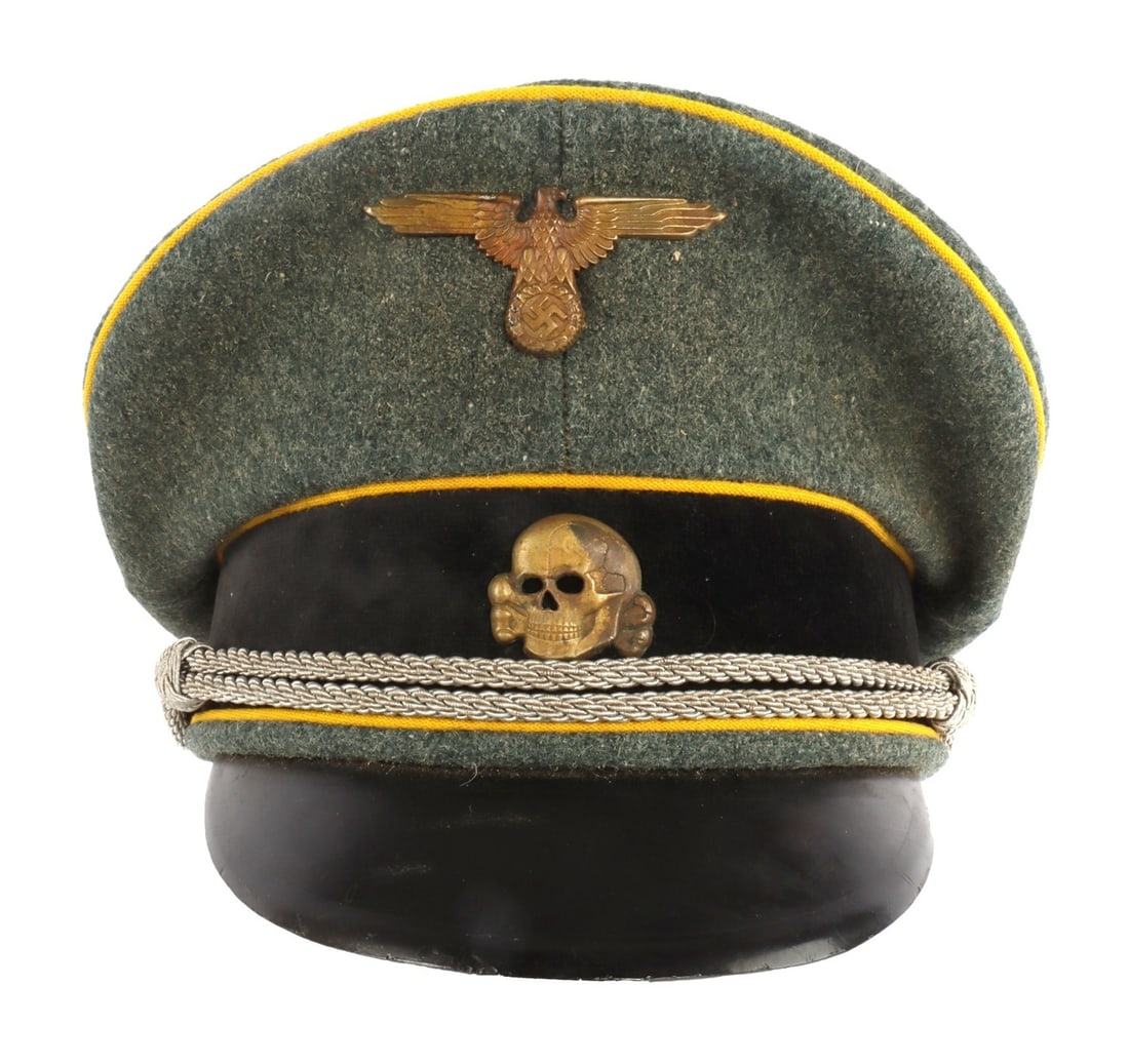 WWII SS NAMED CAVALRY OFFICER VISOR CAP: Visor cap of field grey wool with yellow piping, black doeskin band, aluminum insignia, aluminum bullion wire chinstrap and vulcanized fiber visor. Interior has leather sweatband, rayon liner and
