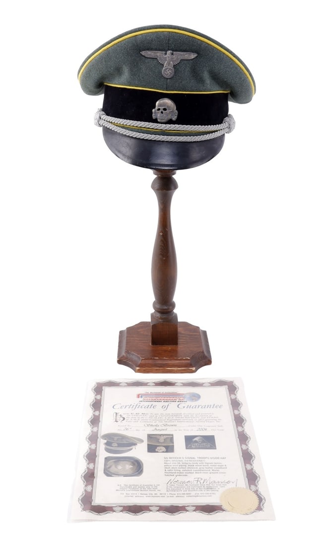 WWII SS SIGNAL TROOPS OFFICER'S VISOR CAP: Visor cap of field grey wool with metal insignia, lemon-yellow piping, black doeskin band, aluminum bullion chin cord and vulcanized fiber visor. Interior has grey rayon liner, perforated leather