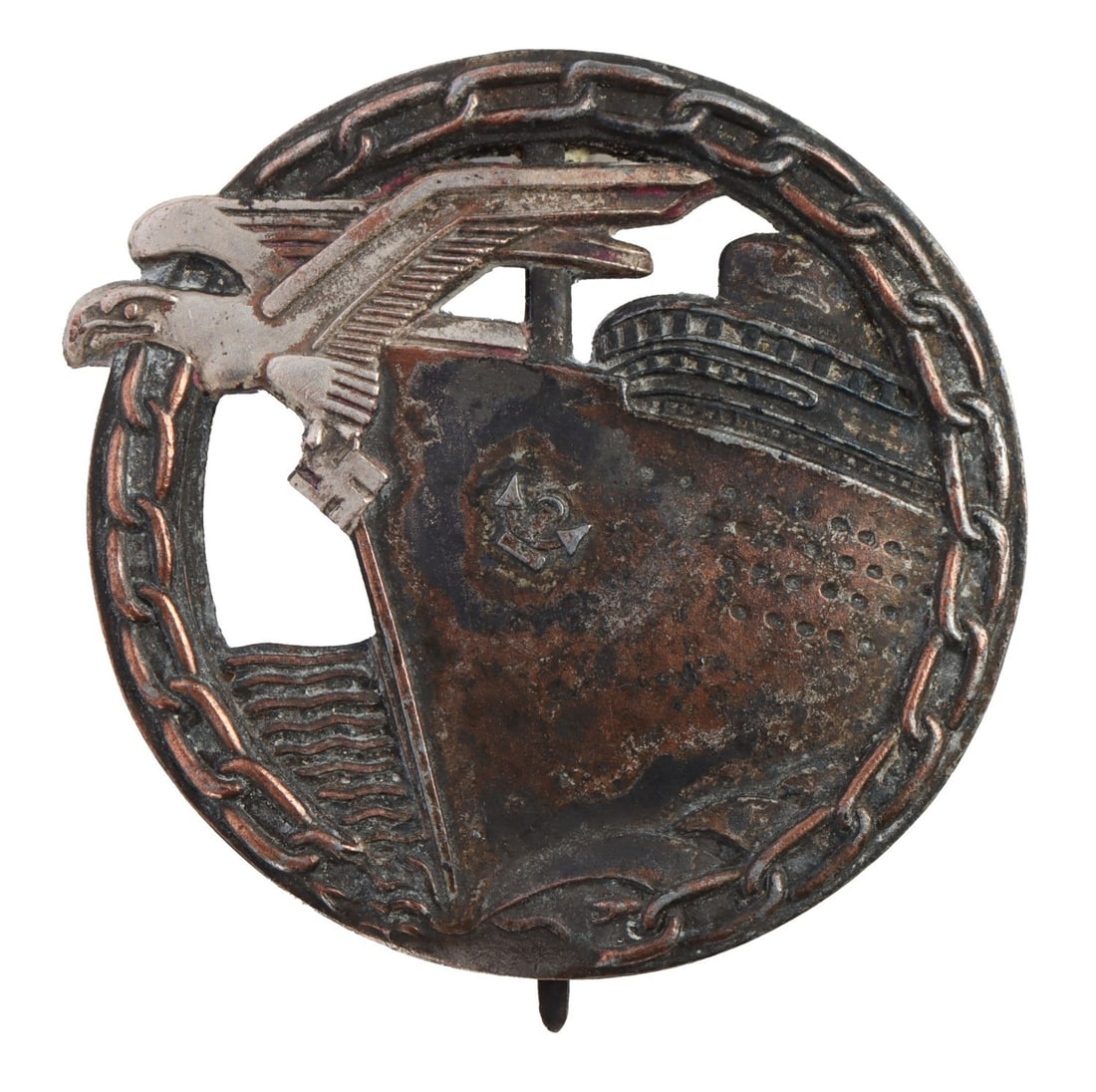 KRIEGSMARINE BLOCKADE RUNNER BADGE OTTO PLACZEK: WWII German Kriegsmarine Blockade Runner Badge. Reverse has flat tapered bin with flat wire catch. Reverse marked "Fec. Otto Placzek Berlin ADSF Schwerin Berlin." Height 1.9 inches. Width 2 inches.