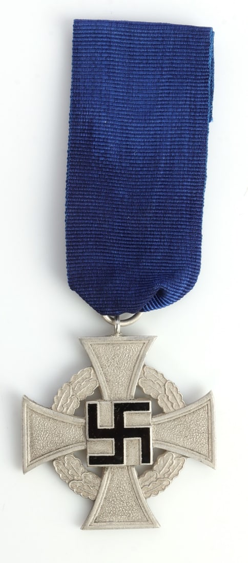 WWII GERMAN FAITHFUL SERVICE CROSS IN SILVER: Silver grade with black enameled swastika and blue ribbon. It measures 1 5/8 inches. This lot has a reserve.