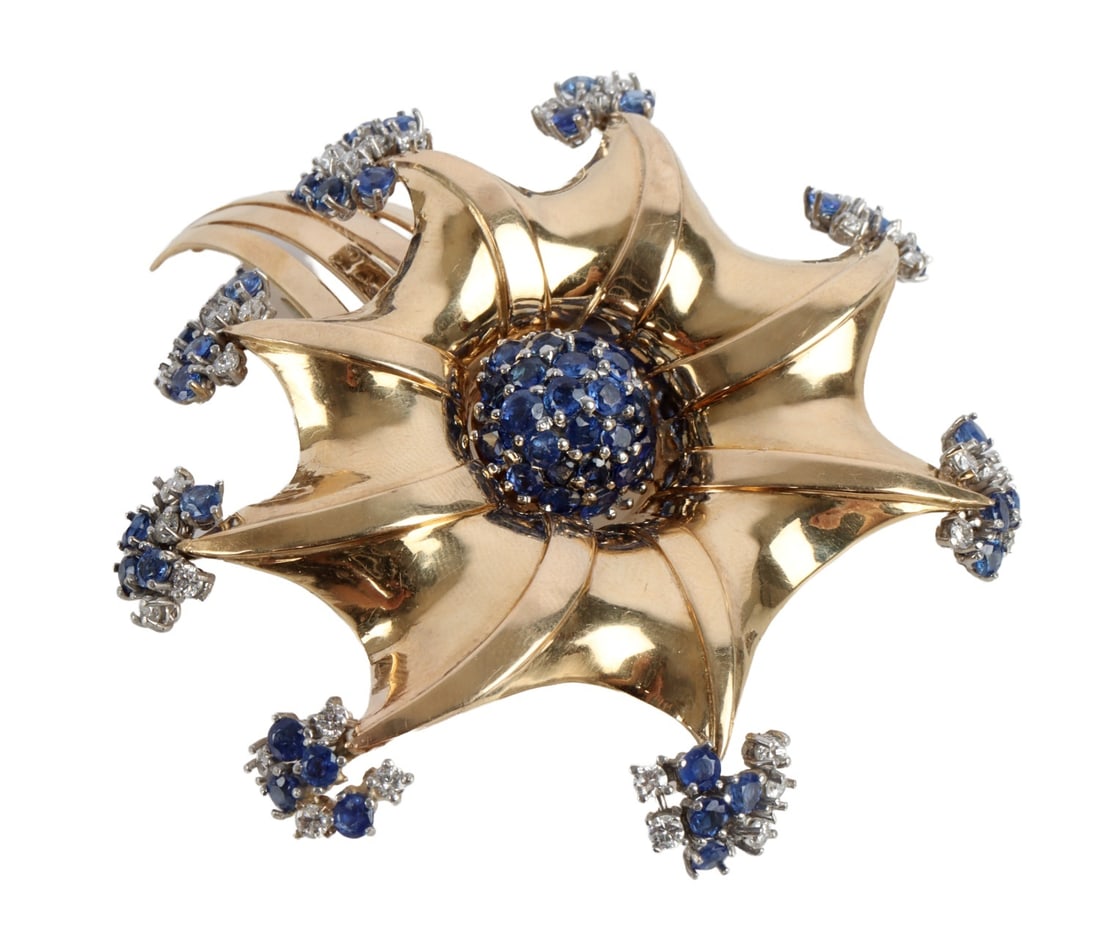 14KT GOLD MORNING GLORY BROOCH WITH TOPAZ: A custom made brooch depicting a morning glory in 14KT yellow gold, with small clusters of diamonds and Swiss blue topaz. Weighs 37.7 grams. Back is stamped 'Reflection,' Trabert & Hoeffer Mauboussin,