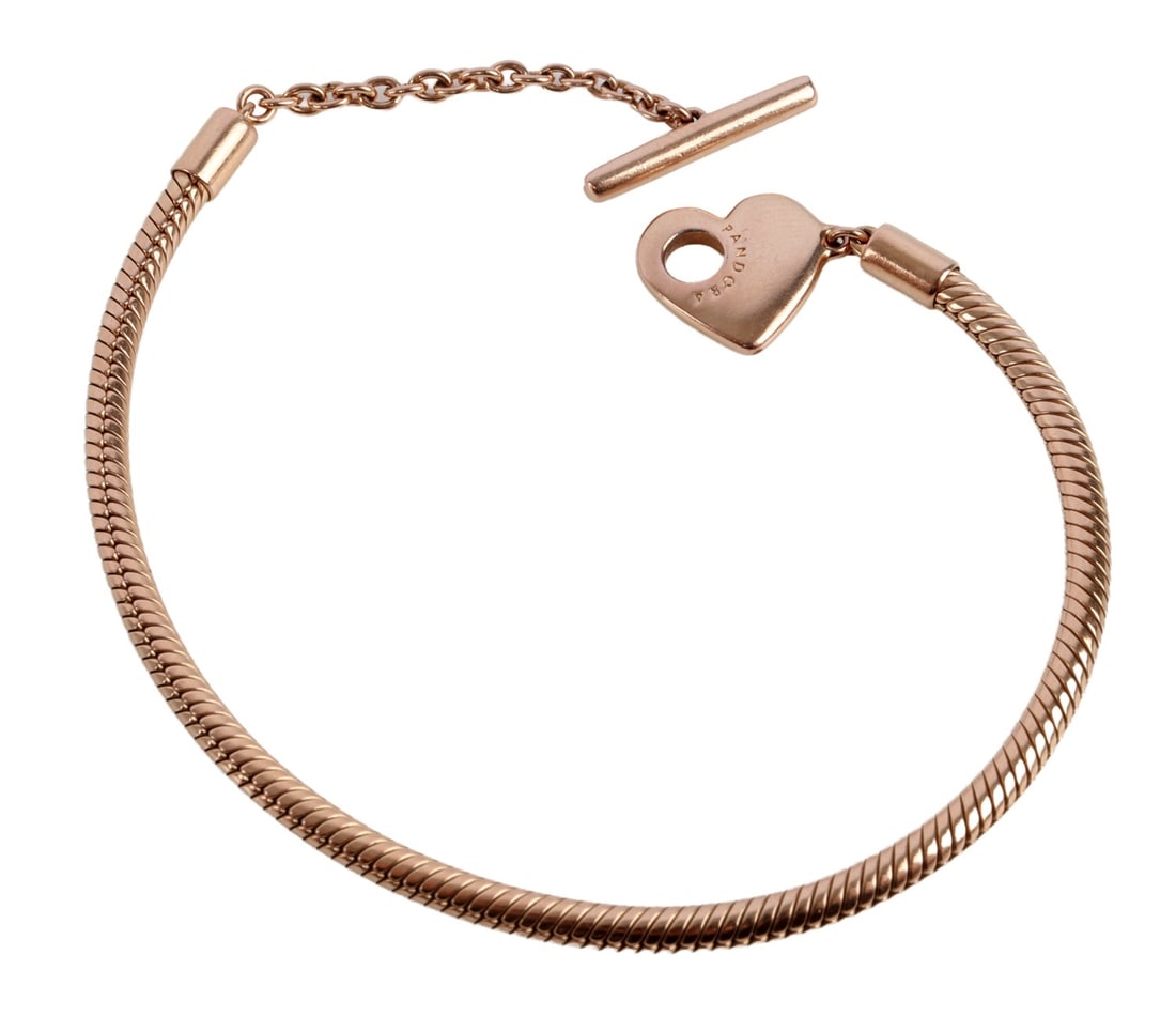 14KT PLATED PANDORA HEART T-BAR BRACELET: 14kt rose gold plated Pandora Moments heart T-bar snake chain bracelet. Metal is 14kt rose gold plate with Pandora metal core (copper and sterling silver). Size charm space is 6.5 inches over all leng