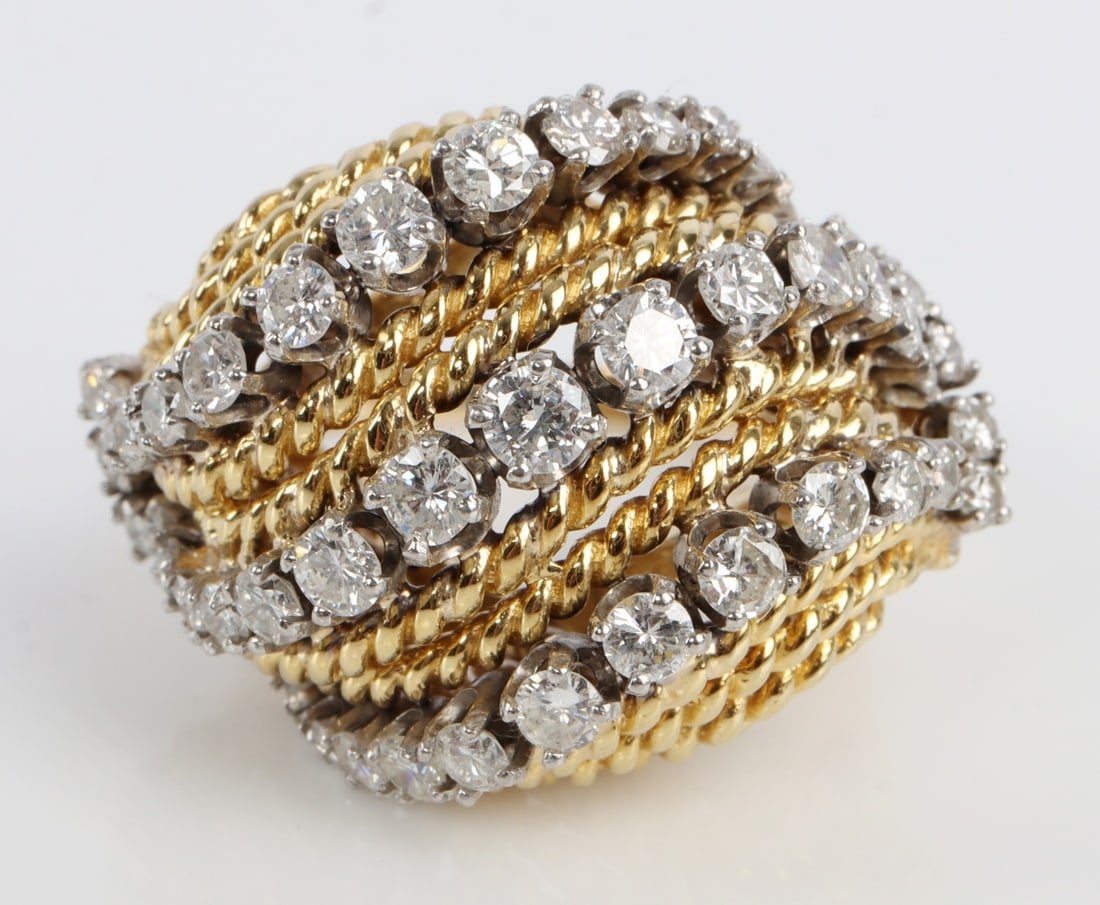 LADIES 14K GOLD RING TWIST DESIGN & DIAMONDS 585: A ladies 14K gold ring with 47 full cut round diamonds, ranging from .3 to .10 carats apiece (3 carats total). Clarity grade: VVS-1 to SI-2. Color grade: E to H. Cutting grade: Good to very good. Expa