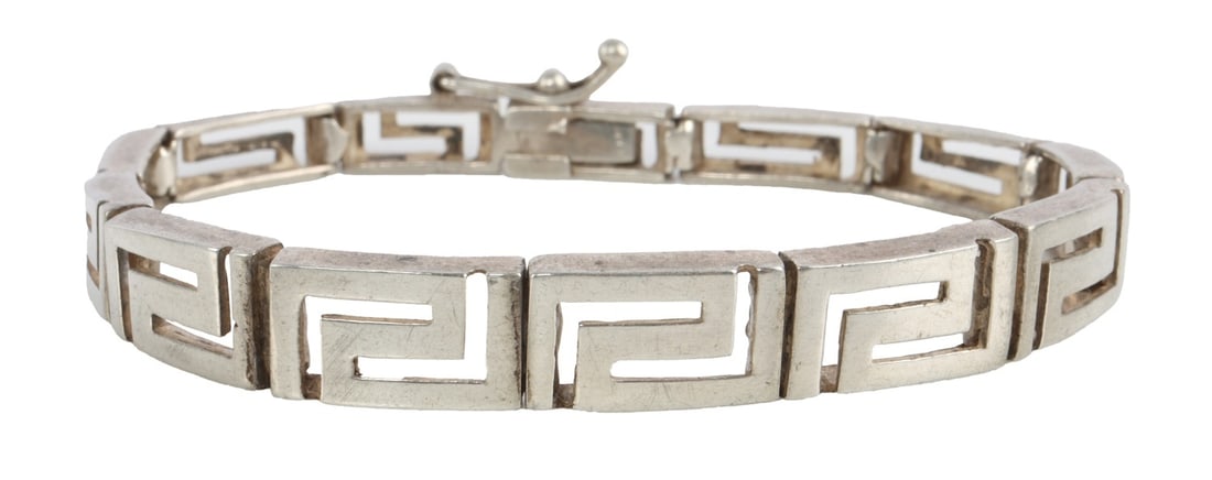 925 STERLING SILVER GEOMETRIC LINK BRACELET: Sterling silver link bracelet with geometric design. Size 7.5 inches. Stamped 925 on center link. This lot has a reserve.