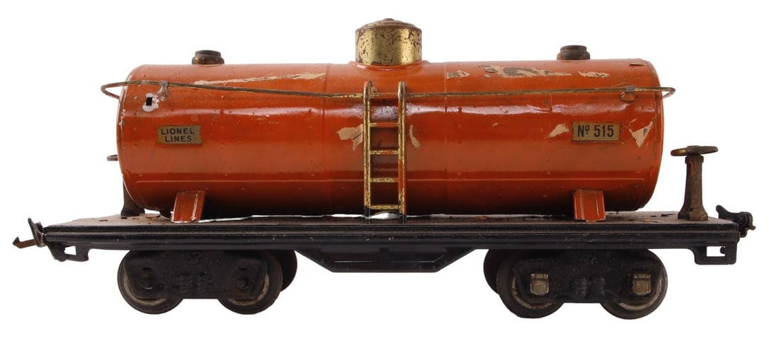 LIONEL MODEL TRAIN CAR 515 OIL TANK: Lionel oil tank car, number 515. Some paper attached to item, but paper would be easily removed without damaging model. This lot has a reserve.
