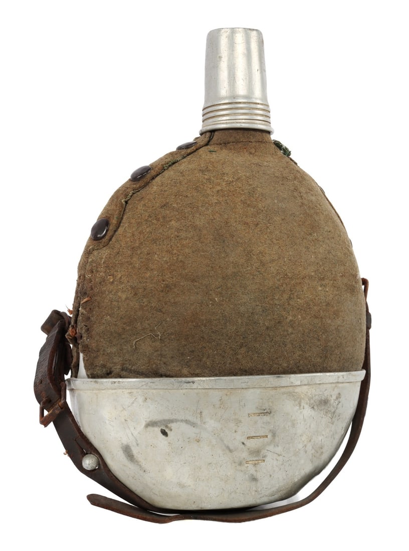 WWII GERMAN THIRD REICH RED CROSS CANTEEN: A WWII-era German canteen for the Red Cross. This was likely a private purchase. With large drinking cap on bottom, twist cap on top, strap, and cover. The cover has some tearing. 7 X 11 inches. Origi