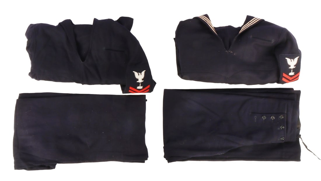 WWII US NAVY NAMED DRESS BLUES UNIFORM LOT OF 4: Lot of four (4) pieces. Includes two crackerjack jumpers and two 13-button trousers. Both jumpers are personalized "Dan Hauer," a disbursing clerk, i.e. paymaster, in the Ninth Naval District.